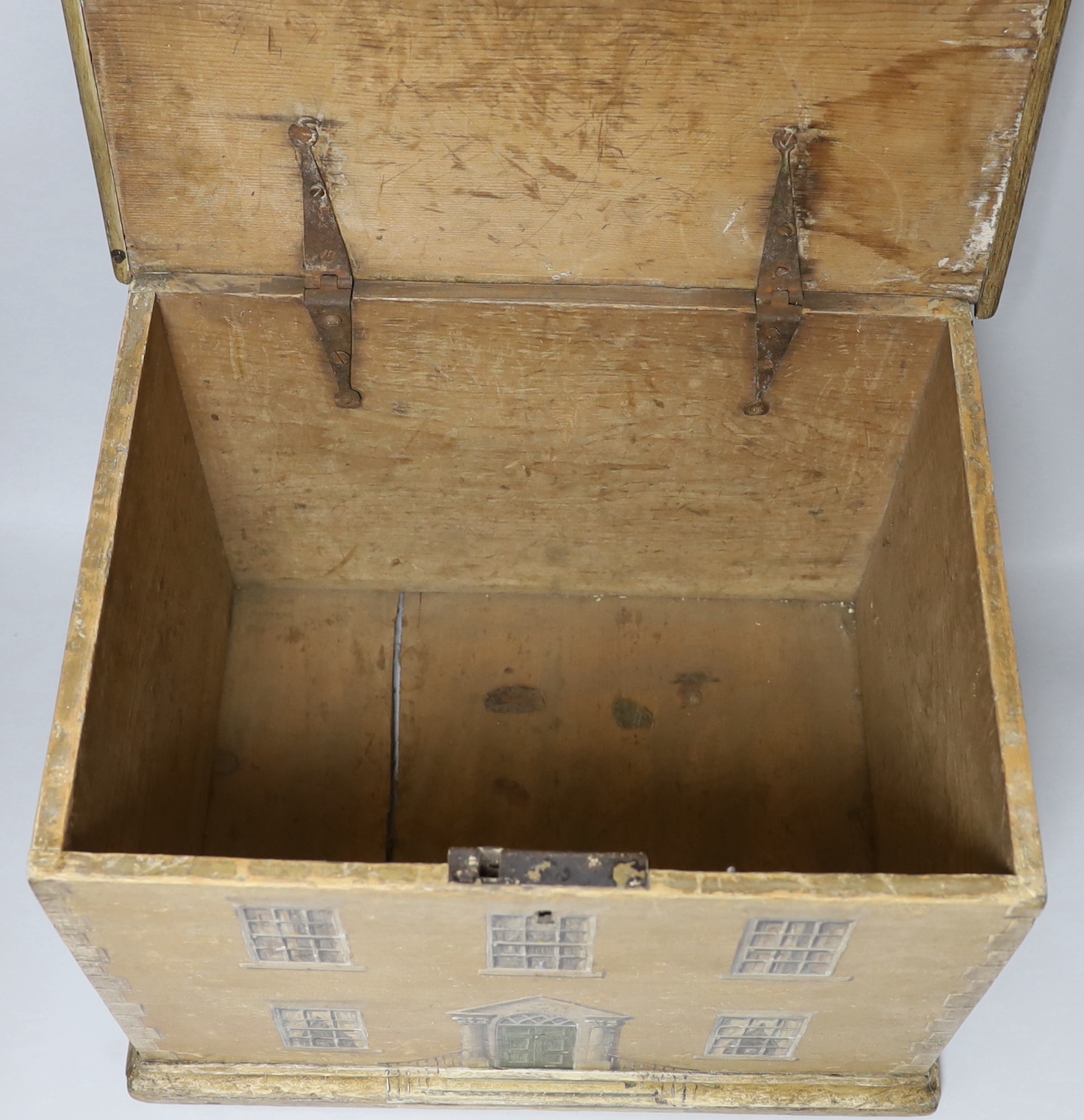 A 19th century pine box overpainted as an earlier Georgian house, painted on three sides, 42cm x 31cm high